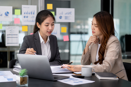 Entrepreneur reflecting during strategic coaching discussion