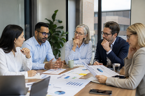 SME leadership reviewing governance oversight and accountability systems