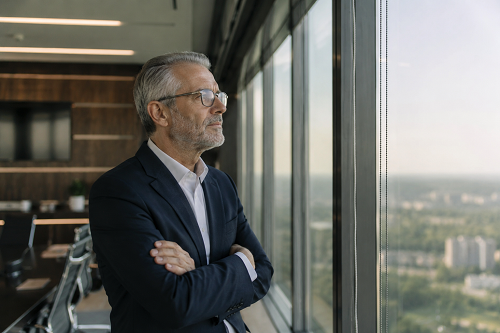 Executive leader reflecting on future goals and leadership sustainability