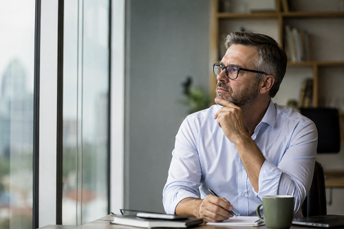 Executive leader reflecting on personal growth and self-awareness