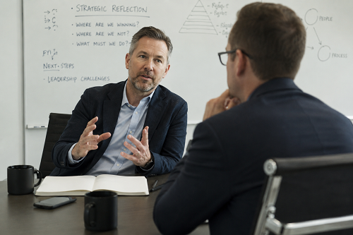 Executive leader discussing strategic reflection and personal leadership challenges