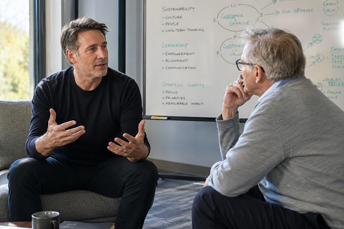 Founder discussing leadership sustainability and strategic clarity with a trusted advisor