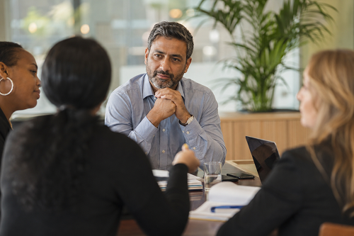 Business leader listening carefully during a team discussion