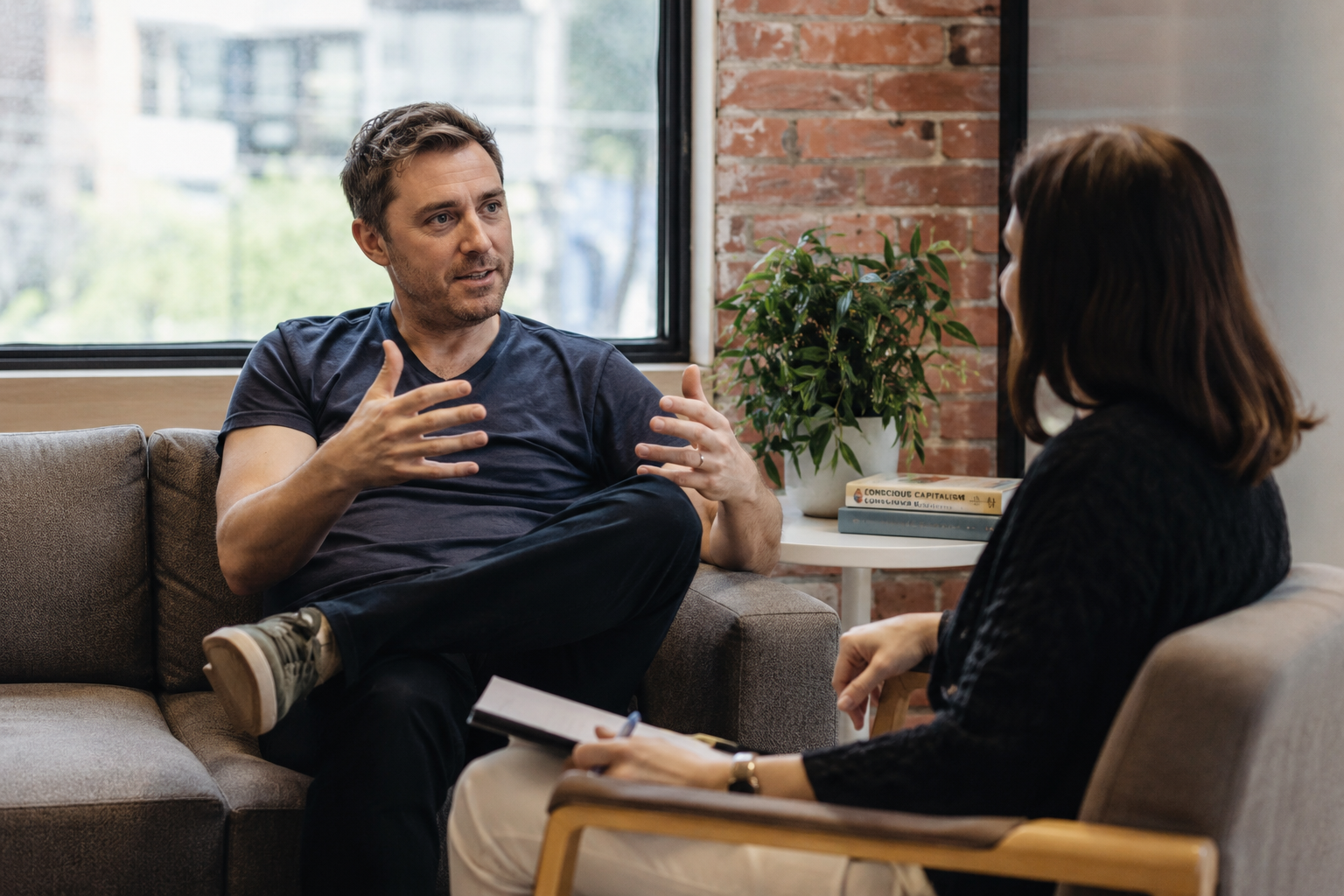 Founder discussing personal development and leadership wellbeing with a coach