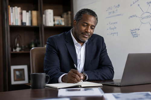 Executive leader reflecting on meaningful leadership and long-term fulfilment