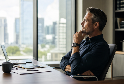 Executive leader reflecting on meaningful leadership and long-term fulfilment