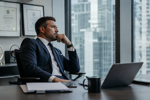 Executive leader reflecting on emotional exhaustion despite professional success