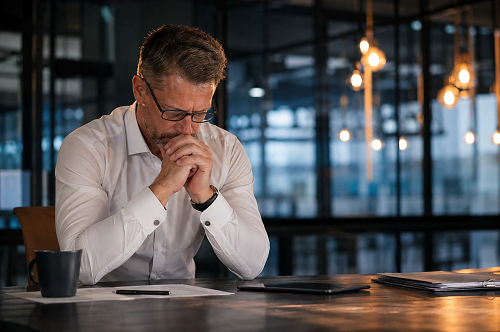 Executive leader reflecting on strategic decision-making and leadership pressure