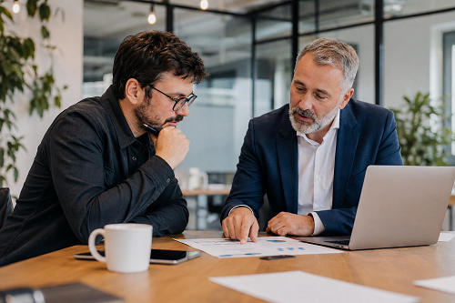 Business owner reviewing growth plans and strategic priorities with an experienced advisor.