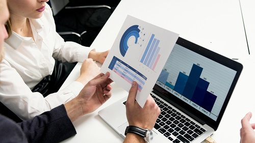 Business professionals reviewing financial charts and graphs, representing strategies to maximise profits.