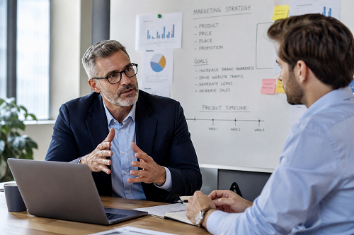 Entrepreneur discussing growth strategy with mentor
