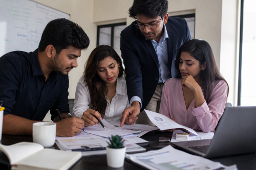 Business mentor reviewing strategic growth plans with entrepreneur