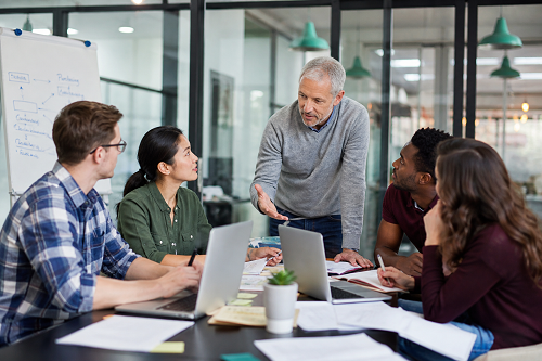 Entrepreneur discussing leadership challenges with mentor