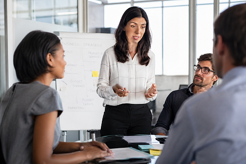 Business mentor listening to entrepreneur during strategic discussion