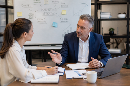 Mentor guiding entrepreneur through strategic business planning