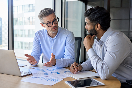 Entrepreneur discussing strategy with business mentor