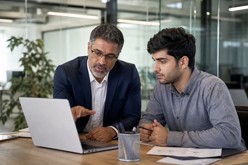 Entrepreneur speaking with online business mentor during video call