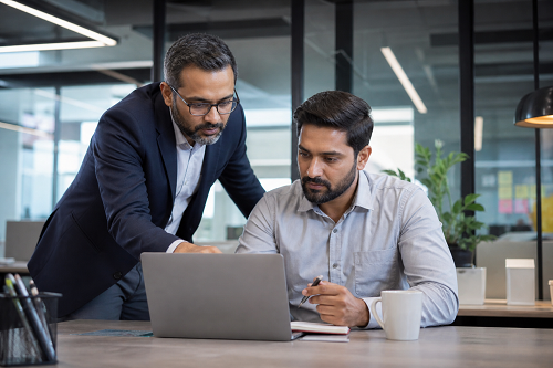 Consultant helping entrepreneur improve business operations