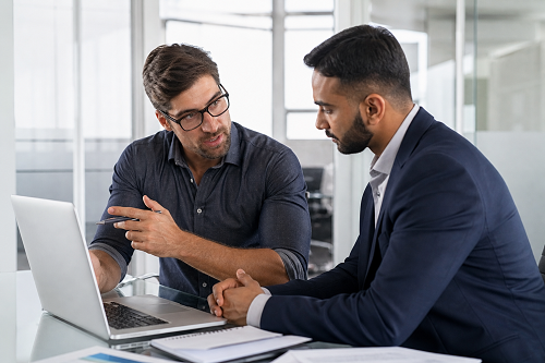Small business owner discussing operational challenges with consultant