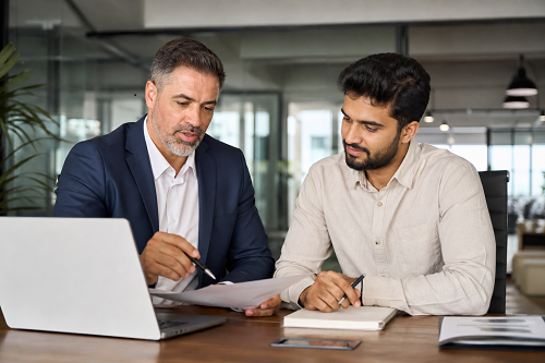 Entrepreneur discussing consulting support options with advisor