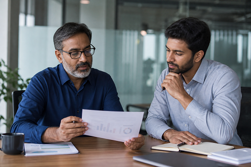 Business mentor reviewing strategic plans with entrepreneur
