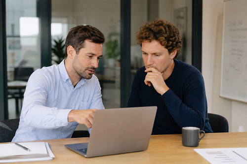 Consultant reviewing operational systems with SME founder