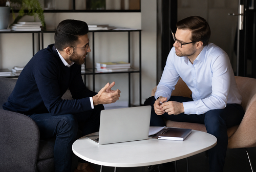 Entrepreneur discussing strategic decisions with business advisor