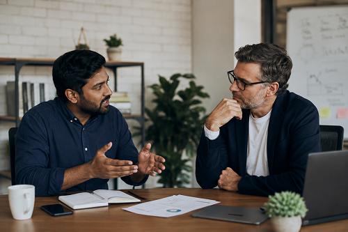 Founder discussing organisational challenges with strategic advisor