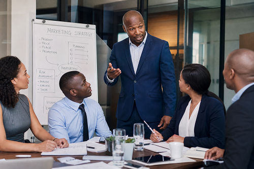 Entrepreneur discussing growth strategy with business coach