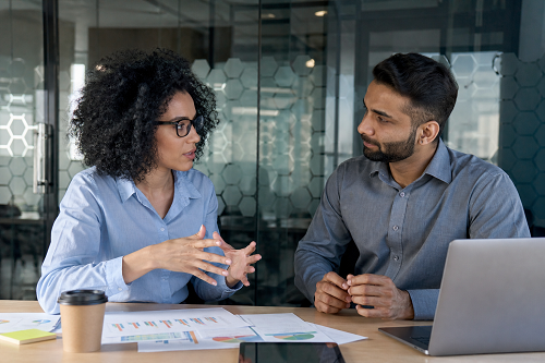 SME owner discussing strategic growth plans with business coach