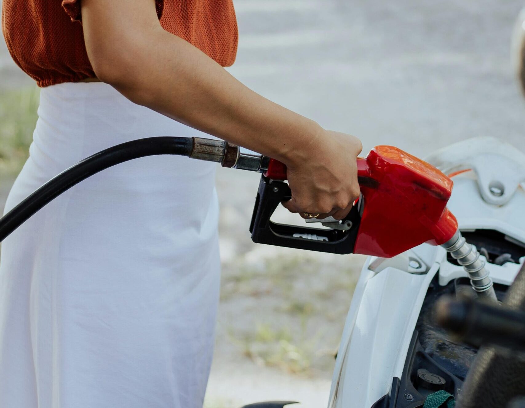 A person refueling their bike representing how to refuel for success